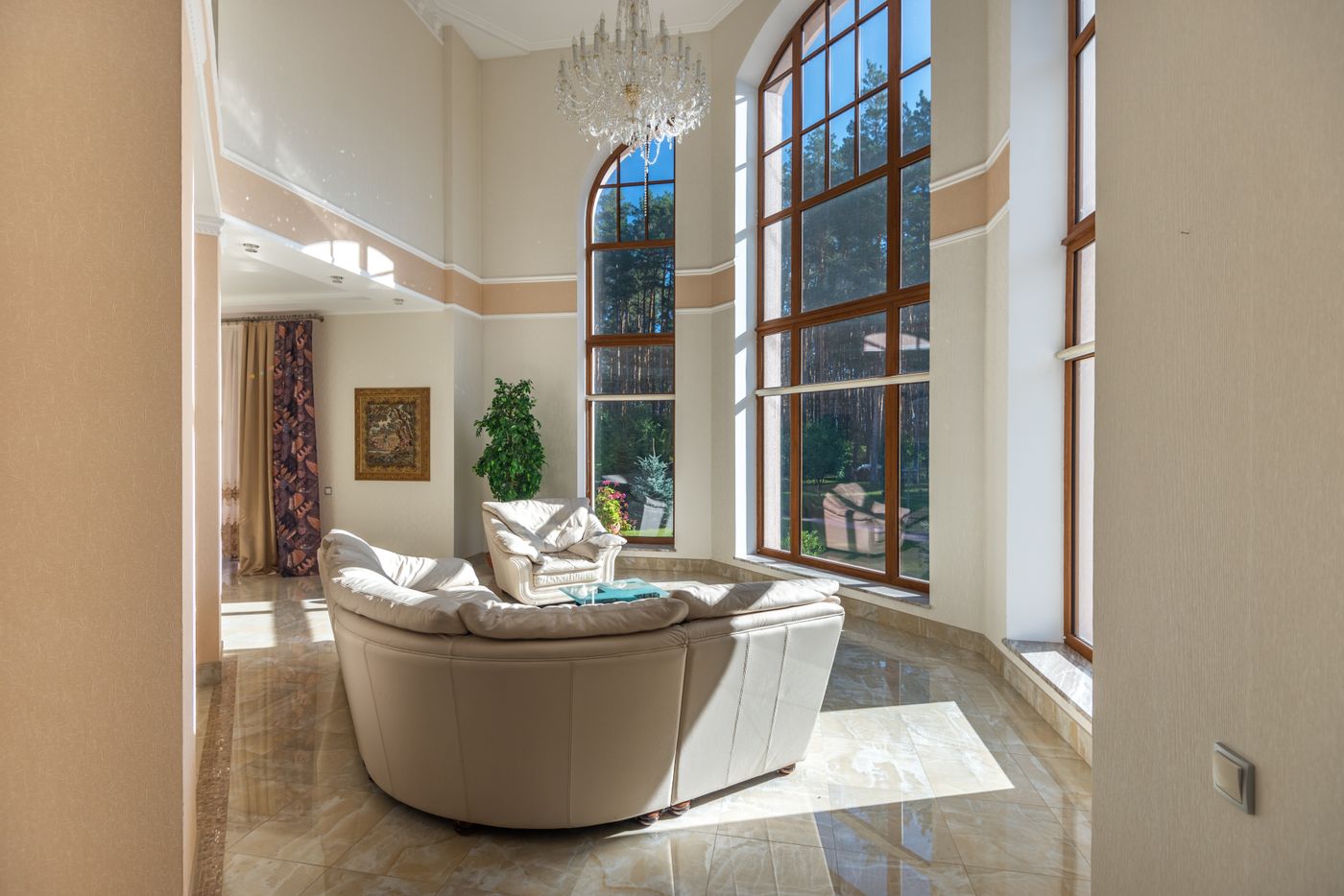 Tall windows overlooking a wooded garden